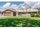 Charming single-story home featuring a well-manicured lawn, brick accents, and a welcoming front yard at 2017 Iowa Ne Ave, St Petersburg, FL 33703