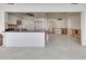 Spacious living area and kitchen featuring granite countertops and white cabinetry ready for personalization at 2017 Iowa Ne Ave, St Petersburg, FL 33703