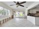 Open kitchen featuring an island, granite countertops, and white cabinetry ready for a new look at 2017 Iowa Ne Ave, St Petersburg, FL 33703