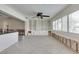 Open-concept living room and kitchen space with natural light and built-in shelving ready for renovation at 2017 Iowa Ne Ave, St Petersburg, FL 33703