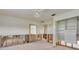 Living room featuring a built-in cabinet ready for renovation, and damaged walls at 2017 Iowa Ne Ave, St Petersburg, FL 33703