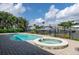 Backyard with a lovely private pool and hot tub surrounded by tropical landscaping at 2017 Iowa Ne Ave, St Petersburg, FL 33703
