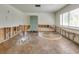 Spacious recreation room featuring a basketball half-court and lockers, ready for renovation at 2017 Iowa Ne Ave, St Petersburg, FL 33703