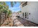An inviting backyard with a brick patio and a white fence, perfect for outdoor relaxation and entertaining at 202 Mindy Dr, Largo, FL 33771