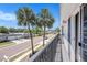 Balcony view overlooking the street with palm trees at 202 Mindy Dr, Largo, FL 33771