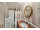 Bathroom featuring a walk-in shower and a vanity with a copper countertop and traditional decor at 202 Mindy Dr, Largo, FL 33771