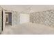 Spacious bedroom with a ceiling fan, white carpeting, and ample closet space at 202 Mindy Dr, Largo, FL 33771