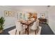 Formal dining room with seating for six and decorative wall art at 202 Mindy Dr, Largo, FL 33771