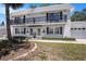 Charming condo with a balcony, manicured lawn, and a one-car garage in a tranquil neighborhood at 202 Mindy Dr, Largo, FL 33771