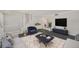 Comfortable living room with plush seating, area rug, and modern decor at 202 Mindy Dr, Largo, FL 33771