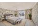 A spacious bedroom with light-toned furnishings and a sliding glass door at 202 Mindy Dr, Largo, FL 33771