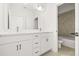 Modern bathroom with double vanity, white cabinetry, and a separate shower and tub at 2043 Wild Heron Ct, Valrico, FL 33596