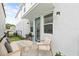 Outdoor patio with seating, a grill, and string lights for a cozy ambiance at 2043 Wild Heron Ct, Valrico, FL 33596
