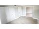 Bedroom featuring new luxury vinyl plank flooring, closet space and neutral paint at 2205 Belleair Rd # A36, Clearwater, FL 33764