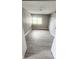 Comfortable bedroom with luxury vinyl plank flooring, closet space, and a large window at 2205 Belleair Rd # A36, Clearwater, FL 33764