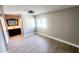 Cozy bedroom with wood-look floors, natural light and a door to the en-suite bathroom at 2205 Belleair Rd # A36, Clearwater, FL 33764