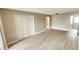 Open living room featuring luxury vinyl plank flooring, large closets and neutral paint at 2205 Belleair Rd # A36, Clearwater, FL 33764