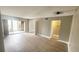Spacious living room with wood-look floors and sliding doors to the outside patio at 2205 Belleair Rd # A36, Clearwater, FL 33764