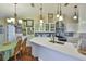 Kitchen featuring white cabinets and a breakfast bar area with pendant lighting at 22115 Laver Ln, Land O Lakes, FL 34639