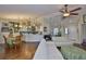 Bright living space connecting to kitchen, featuring hardwood floors and an open design at 22115 Laver Ln, Land O Lakes, FL 34639