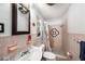 Bathroom featuring a shower, sink, and a built-in shelf at 2353 Dora Dr, Clearwater, FL 33765
