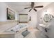 Elegant bathroom featuring a soaking tub, white tile, and a pedestal sink at 2353 Dora Dr, Clearwater, FL 33765