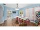 Bright dining area with stylish table and chairs, light blue walls, and lots of natural light at 2353 Dora Dr, Clearwater, FL 33765