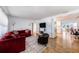 Inviting living room with hardwood floors, a cozy fireplace, and comfortable seating arrangement at 2353 Dora Dr, Clearwater, FL 33765