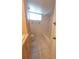 Bathroom featuring vanity with storage, toilet, and shower/tub combination at 2424 W Tampa Bay Blvd # M-201, Tampa, FL 33607