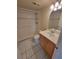 Bathroom featuring tile flooring, neutral walls, a walk-in shower, toilet, and vanity at 2424 W Tampa Bay Blvd # M-201, Tampa, FL 33607