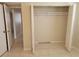 Bedroom featuring tile flooring, neutral walls, and a closet at 2424 W Tampa Bay Blvd # M-201, Tampa, FL 33607