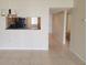 Open-concept living space showcasing the breakfast bar area and natural light at 2424 W Tampa Bay Blvd # M-201, Tampa, FL 33607