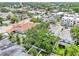 A tranquil aerial view showcases the property, nestled amid mature trees and lush landscaping within the community at 308 S New Jersey Ave # A, Tampa, FL 33609