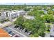 Aerial view of modern apartments with parking in an urban setting with mature trees at 308 S New Jersey Ave # A, Tampa, FL 33609