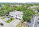 Aerial view of modern townhomes with parking and lush landscaping in an urban setting at 308 S New Jersey Ave # A, Tampa, FL 33609