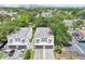 From above, view the townhomes and their location near lush greenery and trees at 308 S New Jersey Ave # A, Tampa, FL 33609