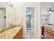 Bathroom includes granite counters, tiled floors, and enclosed glass shower at 308 S New Jersey Ave # A, Tampa, FL 33609