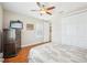 Bedroom with a ceiling fan, modern window, a closet with double doors, and a TV at 308 S New Jersey Ave # A, Tampa, FL 33609