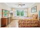 Inviting bedroom with hardwood floors, plantation shutters, and a ceiling fan at 308 S New Jersey Ave # A, Tampa, FL 33609
