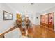 Dining area featuring a glass table, decorative lighting, and access to the kitchen at 308 S New Jersey Ave # A, Tampa, FL 33609