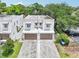Charming two-story townhome features a private two-car garage and neutral stucco facade with a well-manicured lawn at 308 S New Jersey Ave # A, Tampa, FL 33609