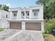 Charming two-story townhome features a private two-car garage and neutral stucco facade with a well-manicured lawn at 308 S New Jersey Ave # A, Tampa, FL 33609