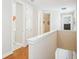 Hallway view with laundry closet and doors to bedrooms and bathrooms at 308 S New Jersey Ave # A, Tampa, FL 33609