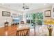 Bright living room featuring hardwood floors, recessed lighting, and a glass sliding door to the covered patio at 308 S New Jersey Ave # A, Tampa, FL 33609