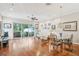 Spacious living room with hardwood floors, contemporary furnishings, and sliding glass doors to screened patio at 308 S New Jersey Ave # A, Tampa, FL 33609