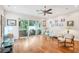 Open-concept living area with hardwood floors, recessed lighting, sliding doors to the patio and contemporary furnishings at 308 S New Jersey Ave # A, Tampa, FL 33609
