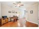 This room features hard wood floors, neutral paint, and a ceiling fan at 308 S New Jersey Ave # A, Tampa, FL 33609