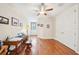 Bright home office with hardwood floors, ceiling fan, desk, and a large closet with double doors at 308 S New Jersey Ave # A, Tampa, FL 33609