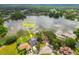 Aerial view of home on lake with pool at 3205 Pleasant Lake Dr, Tampa, FL 33618