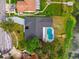 Aerial view of house with a pool and lake access at 3205 Pleasant Lake Dr, Tampa, FL 33618